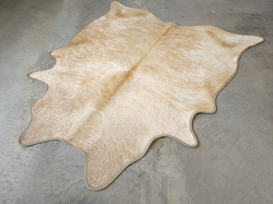 Palomino Exotic Cowhide Rug w/ Leather Binding Size 7 X 7.10 ft