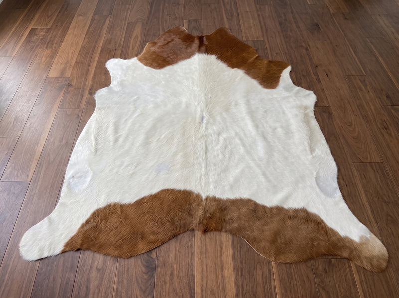 Brown and White Cowhide Rug