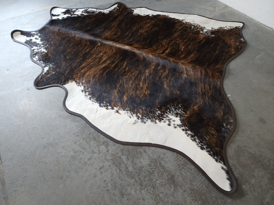 Brindle White Belly Cowhide Rug w/ Leather Binding Size 6.4 X 7.5 ft