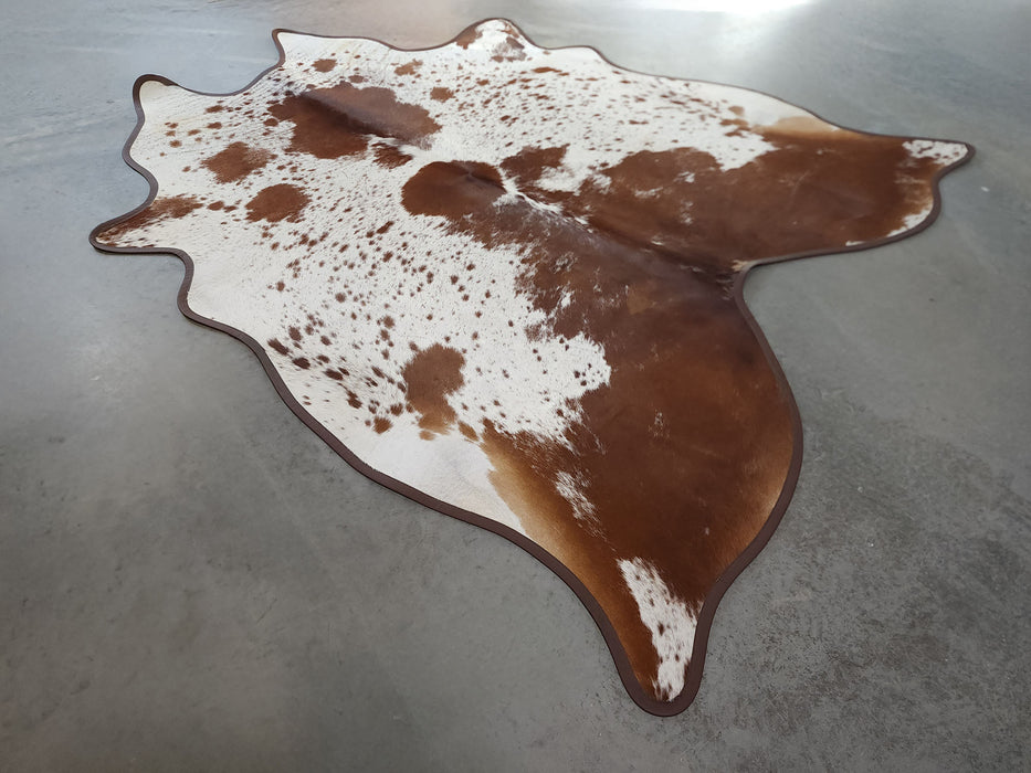 Leather Binding Brown and White Cowhide Rug Size 7.4 X 6.3 ft