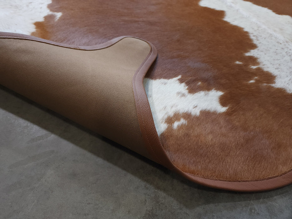 Hereford Cowhide Rug w/ Leather Binding Size 7.1 X 7.3 ft