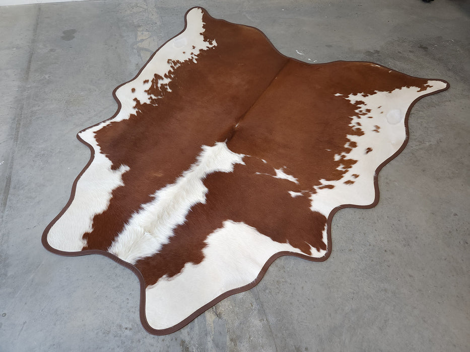 Hereford Cowhide Rug w/ Leather Binding Size 7.0 X 7.4 ft