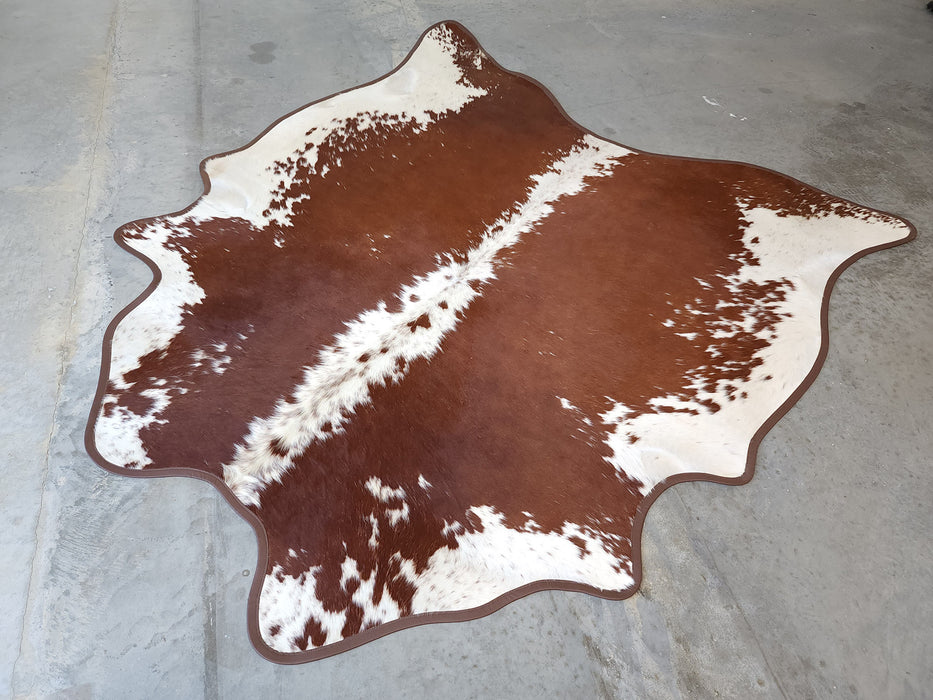 Hereford Cowhide Rug w/ Leather Binding Size 6.7 X 6.11 ft