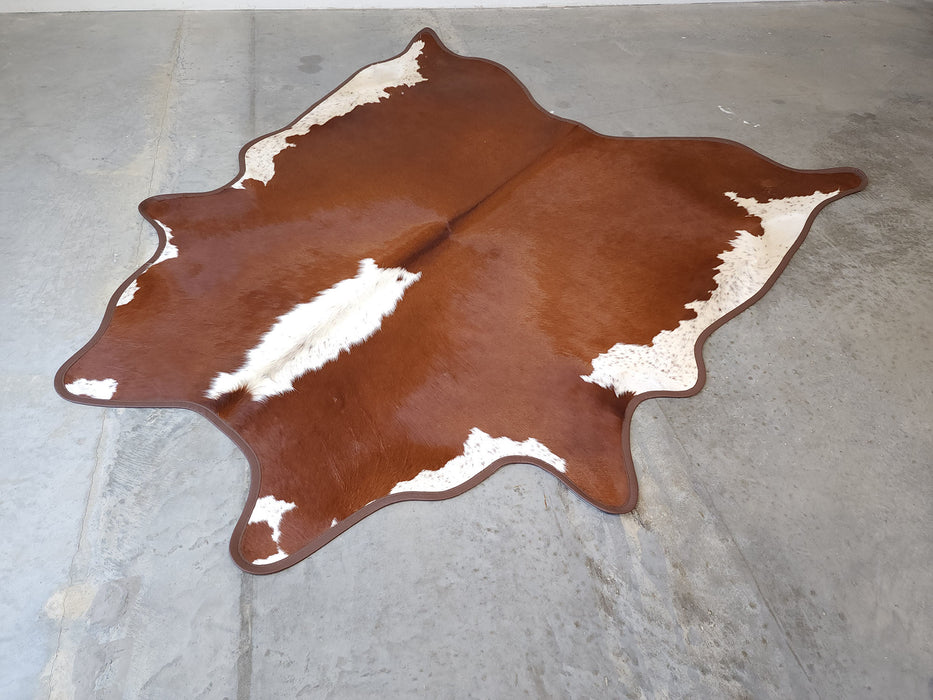 Hereford Cowhide Rug w/ Leather Binding Size 6.7 X 7.3 ft