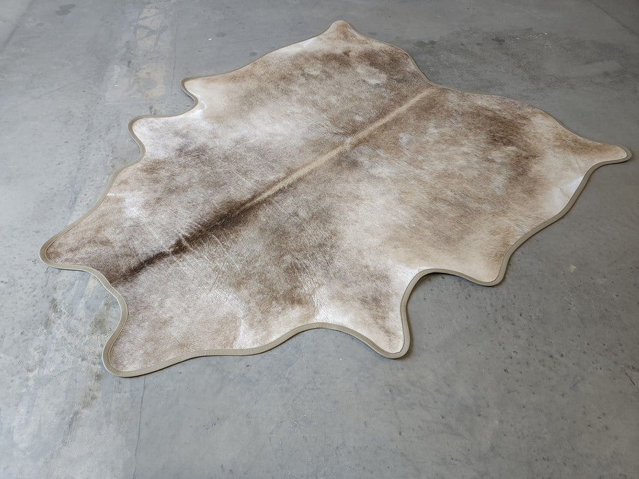 Taupe Exotic Cowhide Rug w/ Leather Binding Size 6.1 X 7.4 ft