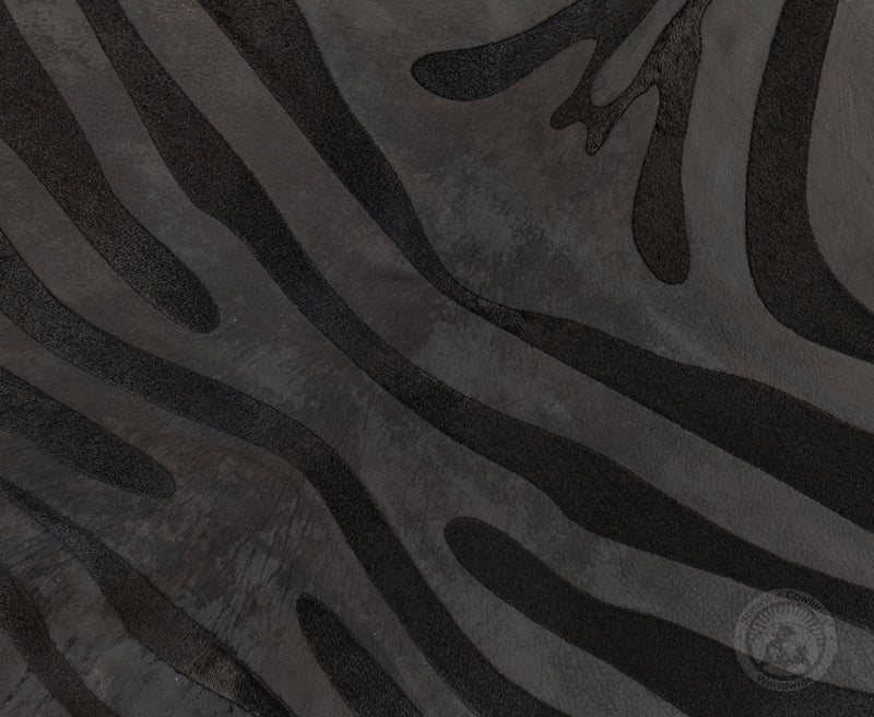 Zebra Acid Wash on Dyed Black Cowhide Rug