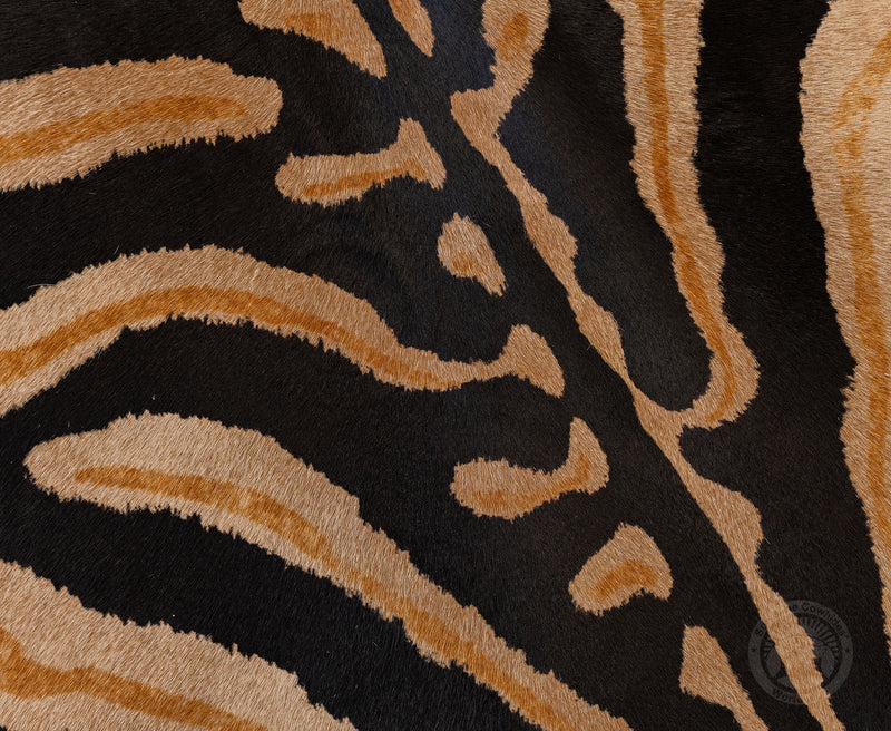 Wild Zebra Stripes on Beige Cowhide Rug