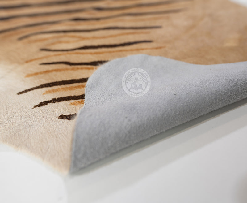 Wild Zebra Stripes on Beige Cowhide Rug