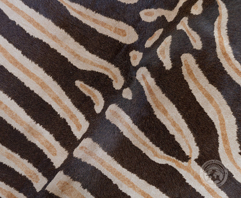 Wild Zebra Stripes on Beige Cowhide Rug