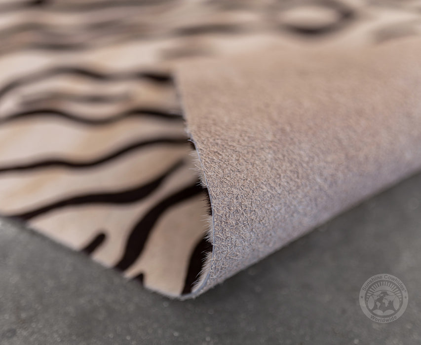 Baby Zebra on Off White Cowhide Rug