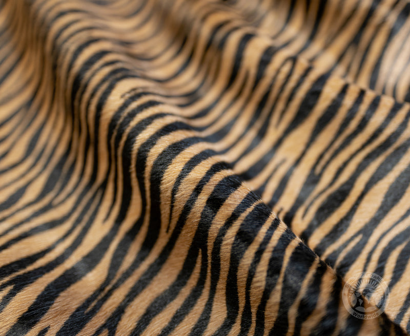 Baby Tiger on Caramel Cowhide Rug