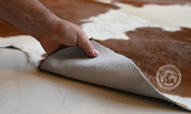 Brown and White Cowhide Rug