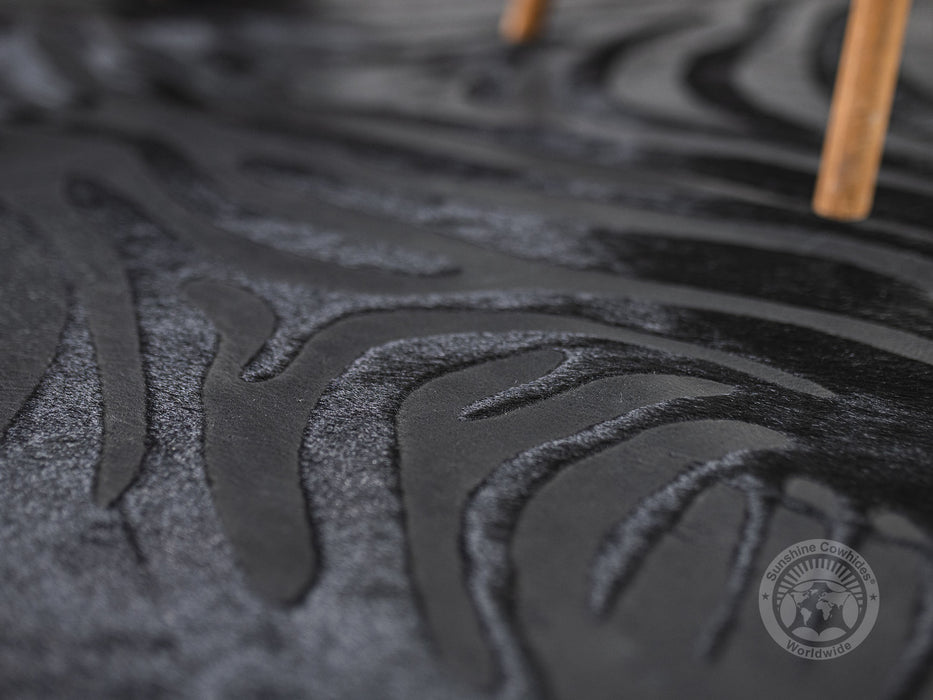 Zebra Acid Wash on Dyed Black Cowhide Rug