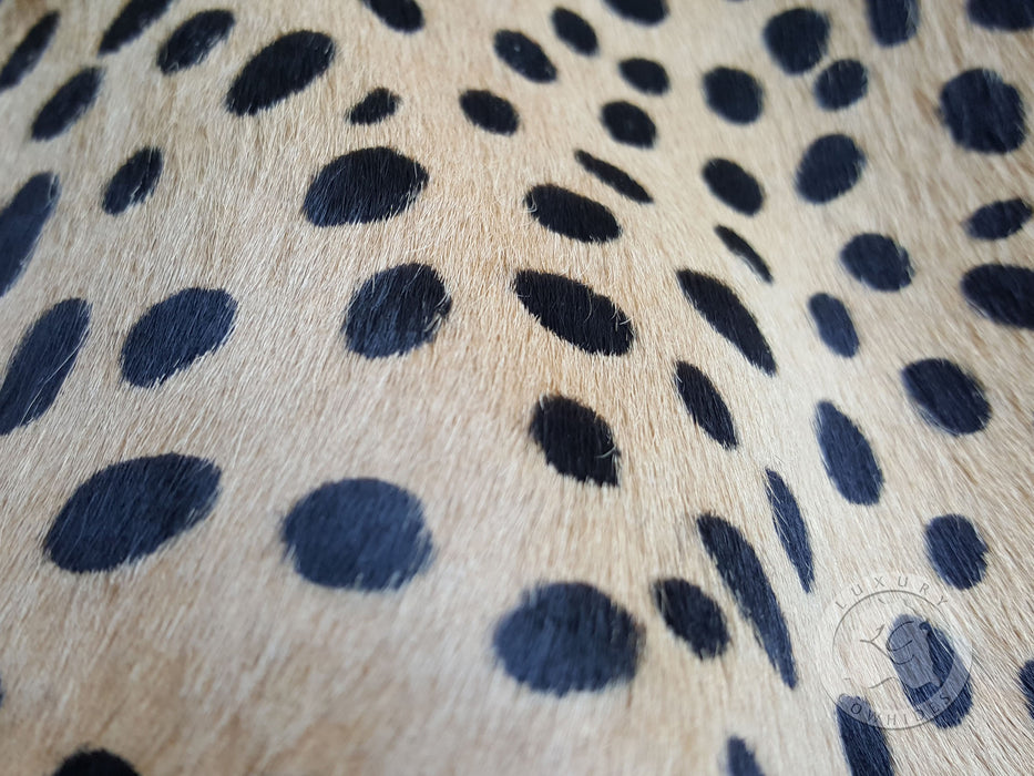 Cheetah on Off White Cowhide Rug
